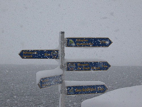 Road signs in German, coverd with snow